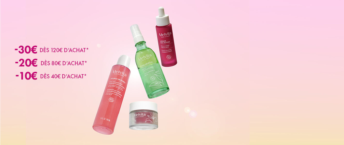 soins Melvita visage et corps en lévitation sur un fond en dégradé du rose au jaune