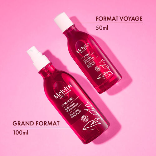 Agrandir la vue7/11 de Le grand format 100ml &agrave; gauche et le format voyage 50ml sont allong&eacute;s sur un fond rose.