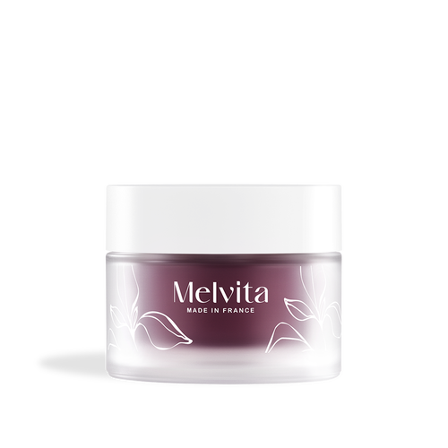 Agrandir la vue1/5 de Le packaging du baume de nuit comporte un pot en verre et une recharge violette fonc&eacute;e avec un couvercle blanc.